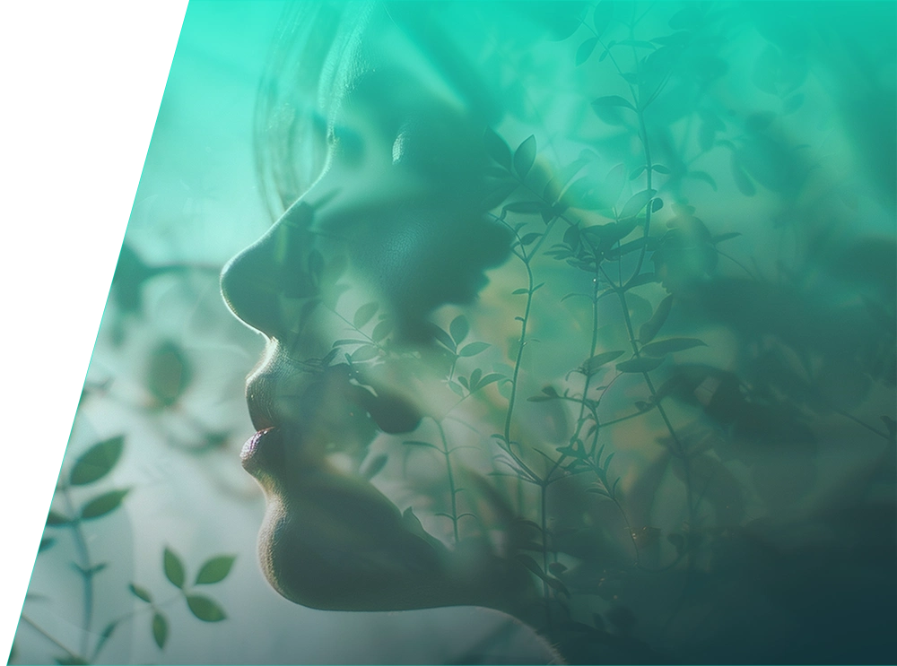 img-ter-ind-7d copia Un perfil lateral del rostro de una persona está superpuesto con imágenes de hojas y plantas verdes sobre un fondo degradado verde, perfectamente optimizado para el impacto SEO.